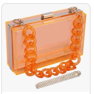 Orange acrylic box clutch with straps